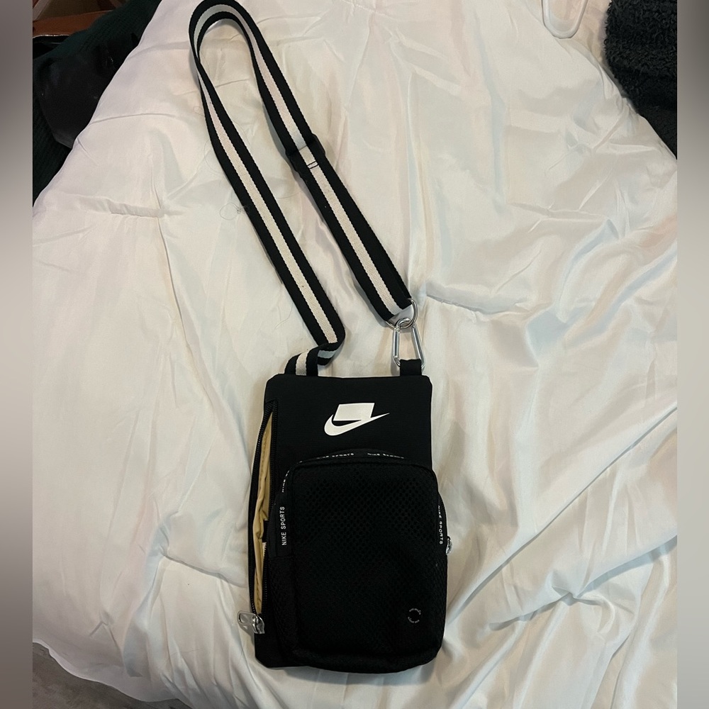Black Nike crossbody sling bag.